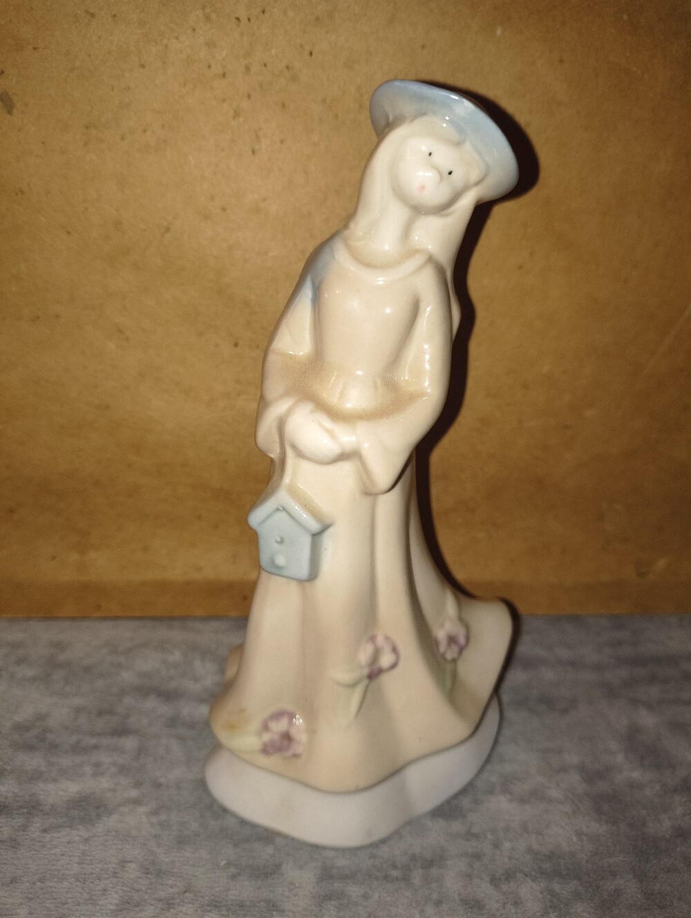 Greenbriar Porcelain Figurine Woman with Birdhouse - Cream and Light Blue